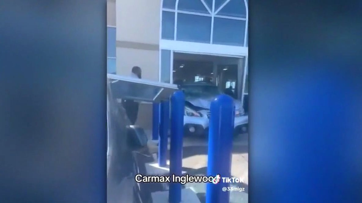 SUV smashes into car dealership; 8 hurt